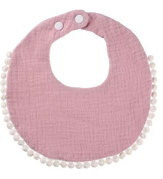 Bavoir bébé rond rose en gaze de coton avec bordure pompons et fermeture à pressions