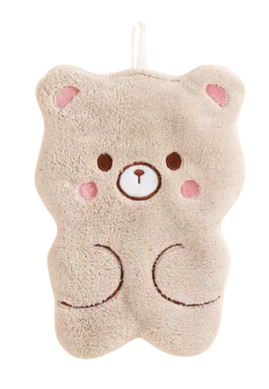 Doudou bébé en forme d’ours beige avec visage brodé, matière douce, boucle de suspension et attache tétine, idéal dès la naissance